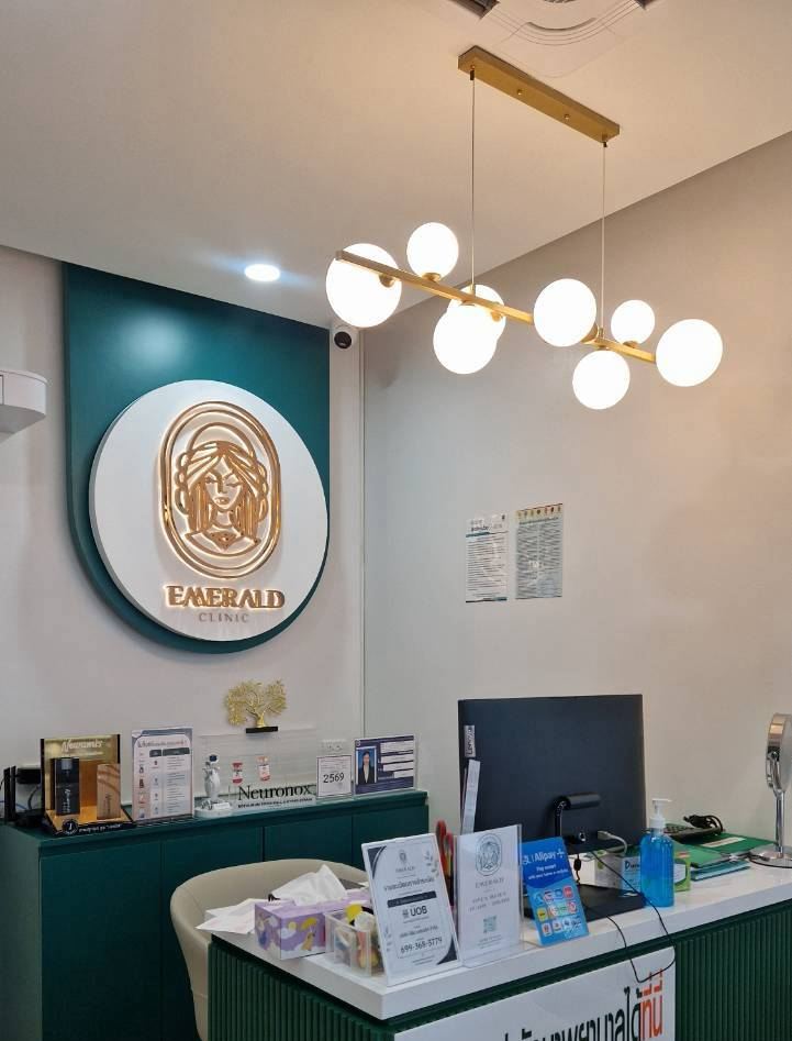 The reception desk under the gold clinic sign